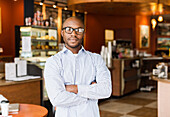 Black man standing in coffee shop, Norfolk, Virginia, USA