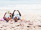 Couple relaxing together on beach, Jupiter, Florida, USA