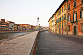 Walkway on urban riverfront, Pisa, Toscano, Italy, Pisa, Toscano, Italy