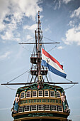 Flag flying from pirate ship against blue sky, amsterdam, amsterdam, holand