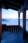Snow covered porch overlooking remote landscape, Olympic Mountains, Washington, USA