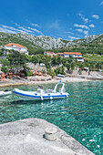 Inflatable boat in lake in remote landscape, rural, Split, Croatia