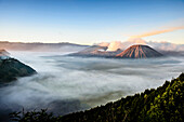 High angle view of clouds under smoking volcano, Mount Bromo, Surabaya, Indonesia