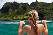 Caucasian girl on boat looking at ocean, Kauai, Hawaii, USA