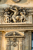 France, Paris, sculptures on the façade of the Louvre Museum