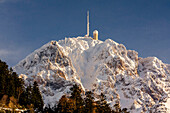 France, Midi Pyreneess, Hautes Pyrenees, The Pic du Midi de Bigorre ans its observatory viewed from the north face in winter