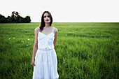 Woman standing in meadow