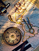 Map of globe with nautical navigation devices