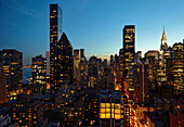 Skyline lit up at night, New York, New York, United States