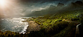 Sun shining over rural coastline, Cape Town, Western Cape, South Africa