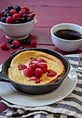 Dutch Pancake with Raspberries in Small Skillet