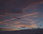 Pink Clouds above Mountains with Jetstream, Alaska, USA