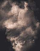 Man with Closed Eyes Standing Behind Smoke