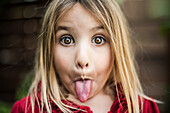 Young Girl Sticking out Tongue, Close-Up