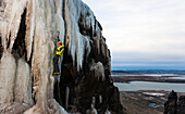 'Robert Halldorsson climbing ''Tviburafoss'' WI4 at Buahamrar climbing area on Mt. Esja, Reykjavik, Iceland.'