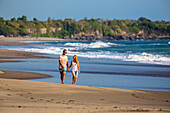 Couple are walking on the beach in Bali. Indonesia