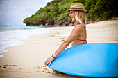 Sufer girl on the beach.