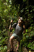 SIERRA NEVADA MOUNTAINS, COLOMBIA -- APRIL 30:  A small group of hikers takes a grueling five day trip through the steamy rainforests of Colombia to reach Cuidad Perdida, the lost city of the Tayronas. Dennis Drenner takes a break along the jungle trail o