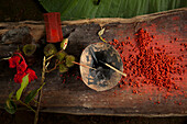 Using the red juices from the  seed-pods of the achiote bush the men of the Tsáchila ethnic group dye the tops of their head red. The tradition dates back to the communities fight with smallpox when the plant was credited with saving their people. Santo D