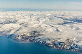 Aerial view of mountains, glaciers and ice fields on the west coast of Spitsbergen on a commercial flight from Longyearbyen to Oslo, Svalbard, Norway, Scandinavia, Europe
