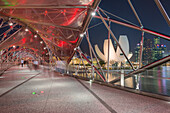 Double Helix Bridge and Art and Science Museum and downtown central financial district at night, Singapore, Southeast Asia, Asia