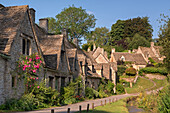 Pretty cottages at Arlington Row in the Cotswolds village of Bibury, Gloucestershire, England, United Kingdom, Europe