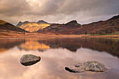 Early morning sunshine on the Langdale Pikes, reflected in Blea Tarn, Lake District, Cumbria, England, United Kingdom, Europe