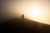 Woman walking on the summit of Volcan Acatenango, Guatemala, Central America