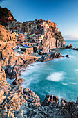 Sunset in the village of Manarola with its pastel coloured houses and its cosy dock, Cinque Terre National Park, UNESCO World Heritage Site, Liguria, Italy, Europe