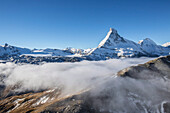 Fog revealing the mountain range surrounding the massif of the Matterhorn, Swiss Canton of Valais, Swiss Alps, Switzerland, Europe