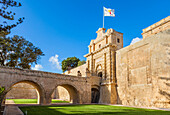 The Main gate with moat, garden and ramparts, Mdina, a Medieval walled city, Mdina, Malta, Europe