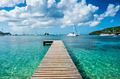 Boat pier in the turquoise waters of Admiralty Bay, Bequia, The Grenadines, St. Vincent and the Grenadines, Windward Islands, West Indies, Caribbean, Central America