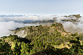 Fog shrouds the volcanic mountains surrounding Cova de Paul on Santo Antao Island, Cape Verde, Africa