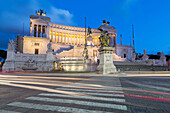 Moving traffic around Piazza Venezia with the Victor Emmanuel Monument at night, Rome, Lazio, Italy, Europe