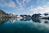 Mountains reflecting in the water in the Magdalenen Fjord, Svalbard, Arctic, Norway, Scandinavia, Europe