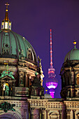 Close-up of the Berliner Dom (Cathedral) with the Television Tower in the background at night, Berlin, Germany, Europe