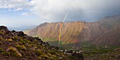 Moroccan High Atlas landscape showing rainbow in the mountains just outside Oukaimeden ski resort, Morocco, North Africa, Africa