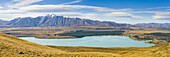 Lake Tekapo and snow capped mountains, Southern Lakes, Canterbury Region, South Island New Zealand, Pacific