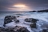 Winter sunrise at Porthgwidden Beach in St. Ives, Cornwall, England, United Kingdom, Europe