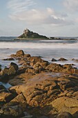 Rocky shoreline and St. Michaels Mount, early morning, Cornwall, England, United Kingdom, Europe