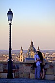 Couple looking at view over the city from Buda Castle, Budapest, Hungary, Europe