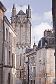 The small streets of Poitiers with the cathedral in the background, Poitiers, Vienne, Poitou-Charentes, France, Europe