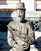 Stone statue of Chinese manufacture showing a European soldier, Wat Suthat, Bangkok, Thailand, Southeast Asia, Asia