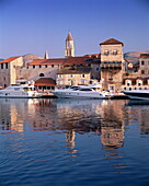 Boats moored in front of the Old Town, Trogir, UNESCO World Heritage Site, Dalmatia, Croatia, Europe
