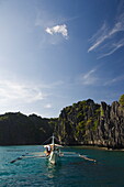 Miniloc Island, catamaran for island hopping, in small lagoon with jagged limestone rock formations, Bacuit Bay, El Nido Town, Palawan Province, Philippines, Southeast Asia, Asia