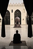 Man praying at the Mosque of Al-Hakim, Cairo, Egypt, North Africa, Africa