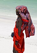 A Maasai tribesman on Paje Beach wearing colourful native dress, Paje, Zanzibar, Tanzania, East Africa, Africa