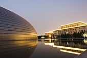 Soviet style Great Hall of the People contrasts with The National Theatre Opera House, also known as The Egg designed by French architect Paul Andreu and made with glass and titanium opened 2007, Beijing, China, Asia