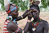 Two men from the Hamer tribe preparing for the Jumping of the Bull ceremony, Omo Valley, Southern Ethiopia, Ethiopia, Africa