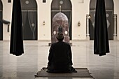 Man praying at the Mosque of Al-Hakim, Cairo, Egypt, North Africa, Africa